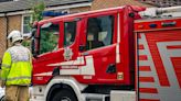 Firefighters rescue person trapped inside household room