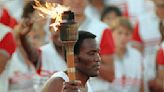 Rafer Johnson lighting Olympic flame in '84 ultimate moment for Coliseum, his family