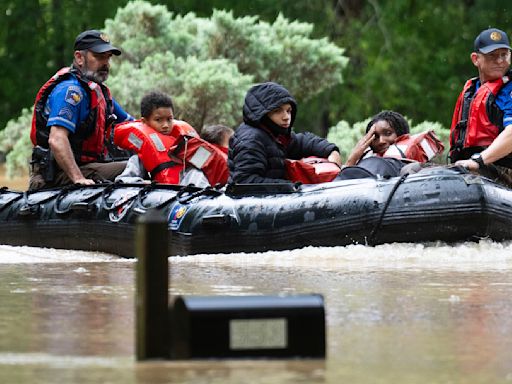 Southeast Texas flooding: photos capture water rescues of people and pets and severe damage to homes