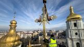 Authorities return restored golden crosses to the domes of Kyiv's St Sophia Cathedral