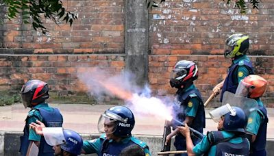 Bangladesh protesters set state TV HQ ablaze as toll mounts, internet cut