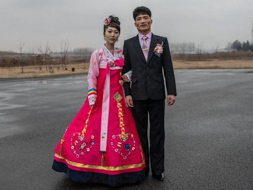 North Korea cracking down on wedding dresses and slang - report