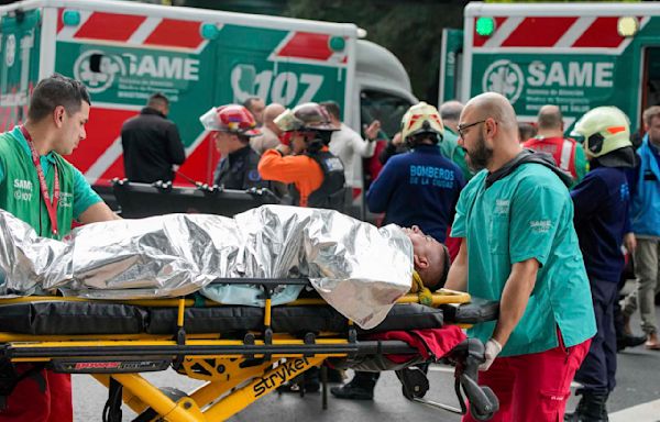 A train in central Buenos Aires strikes a boxcar on the track, injuring dozens