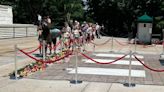 Guests leave hundreds of flowers to honor the Tomb of the Unknown Soldier