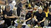 Nvidia's billionaire CEO Jensen Huang enjoys Vietnam's street food during Hanoi visit