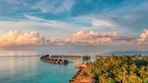 Overwater bungalows started as a bottom-tier accommodation. Today, they're a status symbol in the luxury travel world.