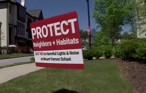 Signs protesting Sandy Springs school’s plan to add stadium lights stolen, neighbors say