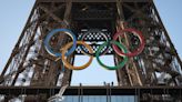 Paris Olympics organizers unveil a display of the five Olympic rings mounted on the Eiffel Tower