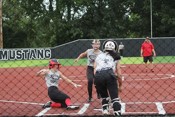 Lady Mustangs battle the rain in softball practice | McDonald County Press