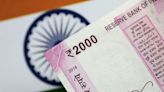 Indian rupee falls to record low hurt by likely outflows, importer dollar demand