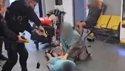 Police officer suspended after footage shows suspect being stamped on the head at Manchester Airport