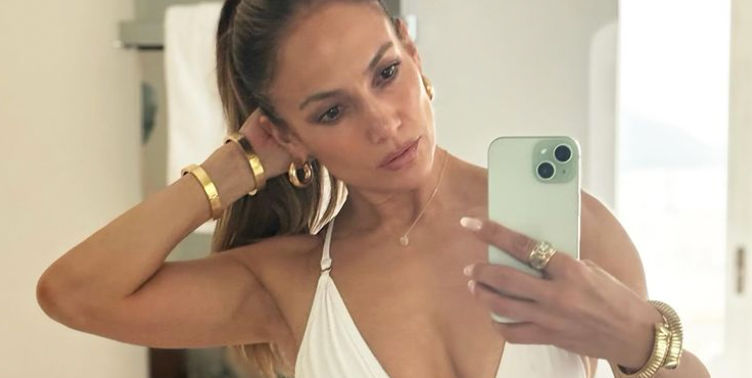 JLo's plunging white swimsuit ticks off so many summer trends