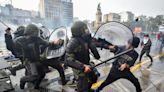 Argentine riot police disperse protesters with water cannons and tear gas ahead of key Senate vote