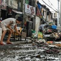 'Back to zero': Manila flood victims clean up, start again