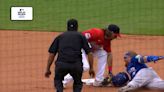 Turner's wayward helmet blocks tag in wild play, rendering him safe