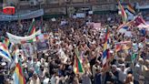 Syrians tear down poster of Assad in Sweida as protests swell