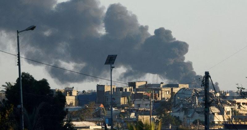 FILE PHOTO: Smoke rises from an Israeli air strike in Rafah as seen from Khan Younis