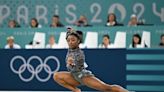 Simone Biles Leads U.S. in Olympic Team Qualifying Despite Injury