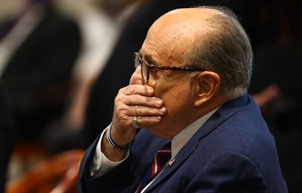 Was Rudy Giuliani Peeing During His Arraignment? You Be the Judge!
