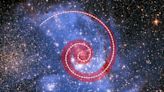 A dense stellar nursery may feed on a spiral of stars, scientists say