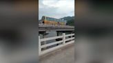 Passengers chase out-of-control bus as it rolls across bridge