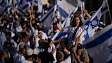 Israeli nationalists march in Jerusalem as a far-right minister boasts of Jewish prayer at key site