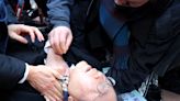 A South Korean political leader was stabbed in the neck by someone asking for an autograph