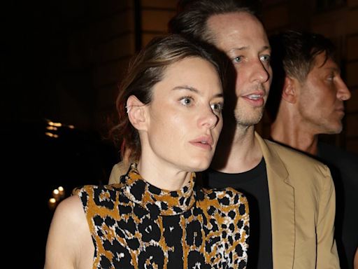 Camille Rowe and Nikolai Von Bismarck arrive together at Vogue party