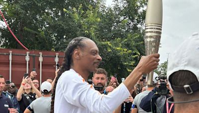 Crowds cheer as Snoop Dogg carries Olympic torch for Paris 2024 Games