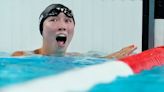 Video: U.S. swimmer invites teammate to top of the podium after winning gold