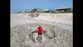 Giant hole appears on NC beach — and enthusiastic tourists are to blame, town says