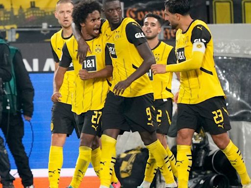 Football: Borussia Dortmund thump Bochum; AC Milan beat Lecce to go level with Serie A leaders Torino