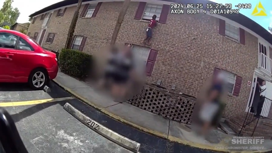 VIDEO: Woman scales apartment building to avoid arrest