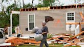 Storm-battered South is again under threat. A boy swept into a drain fights for his life