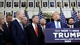 Republican presidential candidate, former U.S. President Donald Trump is flanked by Senate Republicans as he gives remarks to the press at the National Republican ...