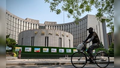 China’s central bank cuts key short-term rate to buoy economy - CNBC TV18