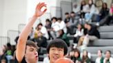 He's 6'11 and a George School freshman from China. He's living his American hoops dreams