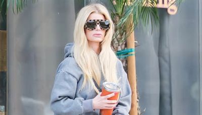 Jessica Simpson appears slightly disheveled as she steps out with her clip-in hair extensions showing in LA