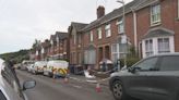 Woman appears in court after human remains found at house | ITV News