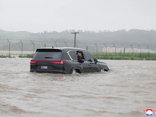 Kim Jong-un surveys massive flooding in North Korea from his Lexus as 5,000 rescued