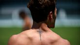 At the Olympics, athletes show guts, glory – and a lot of ink, including tattoos that profess their faith