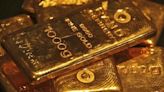 Gold prices slide as M.East fears ease, rate jitters persist