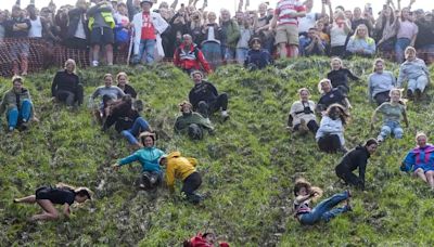 Daredevils defy weather for annual cheese rolling races