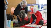 No-judgment zone: At Johnson County libraries, kids can read aloud to furry audiences