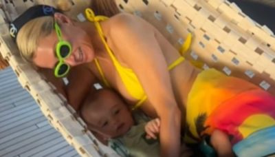 Paris Hilton snuggles up with her son Phoenix in a hammock