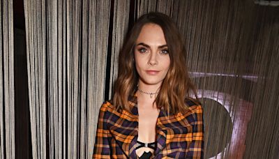 Cara Delevingne teases a glimpse of bra at gala perfomance of Cabaret