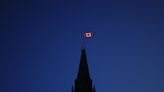 Different schools of thought on why Canada drapes itself with red and white