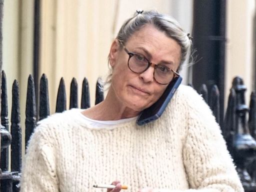 Actress, 58, looks unrecognizable as she smokes cigarette in London