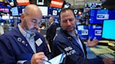 Wall Street gyrates to muted close as investors weigh jobs data in rate debate