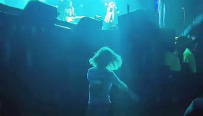 Mick Jagger's lookalike son Deveraux, 7, proves he's inherited his dad's famous moves as he lets loose in the audience while the Rolling Stones rocker, 80, performs in Texas